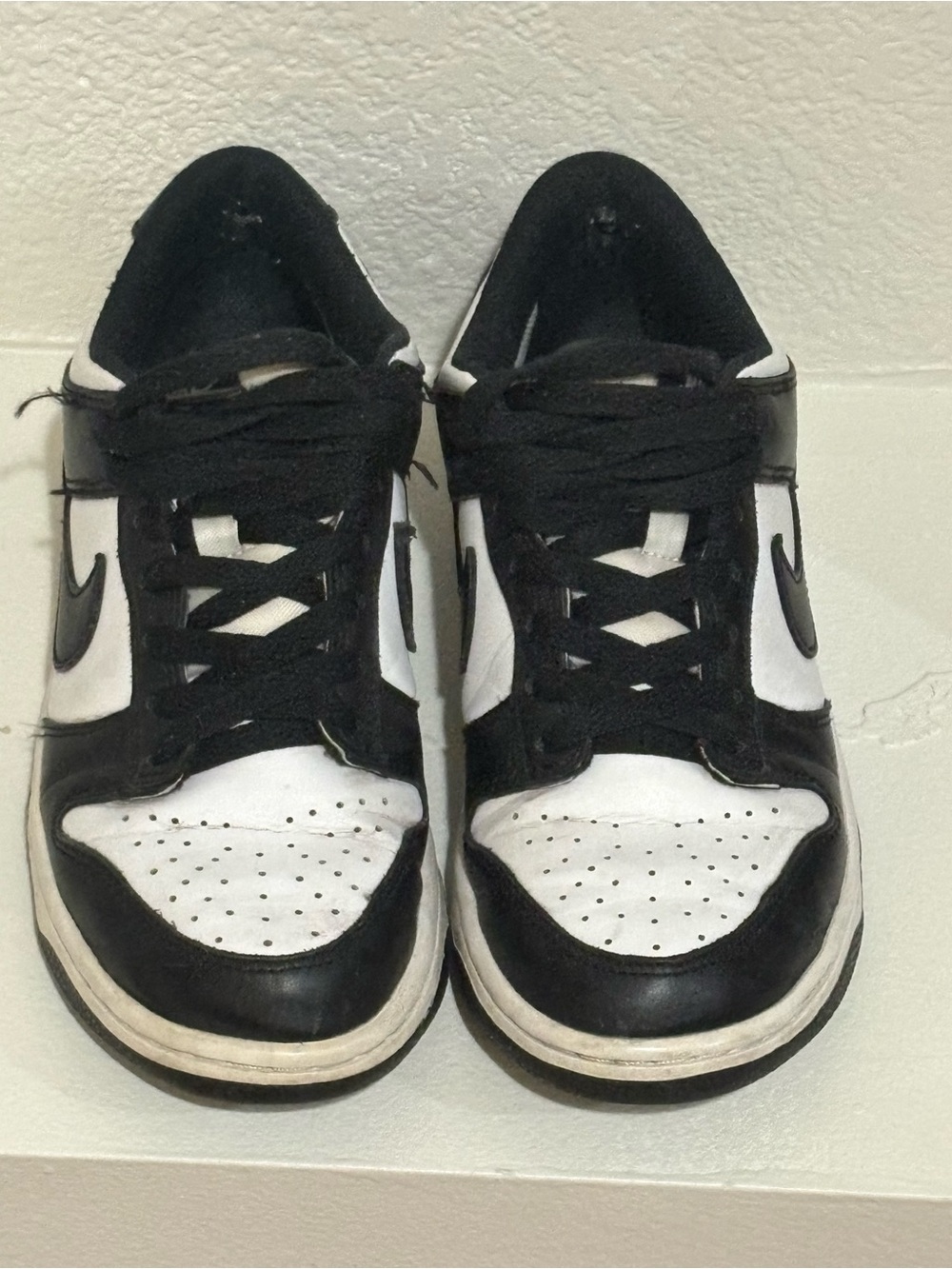 Nike women’s Black and White Low-Top Sneakers